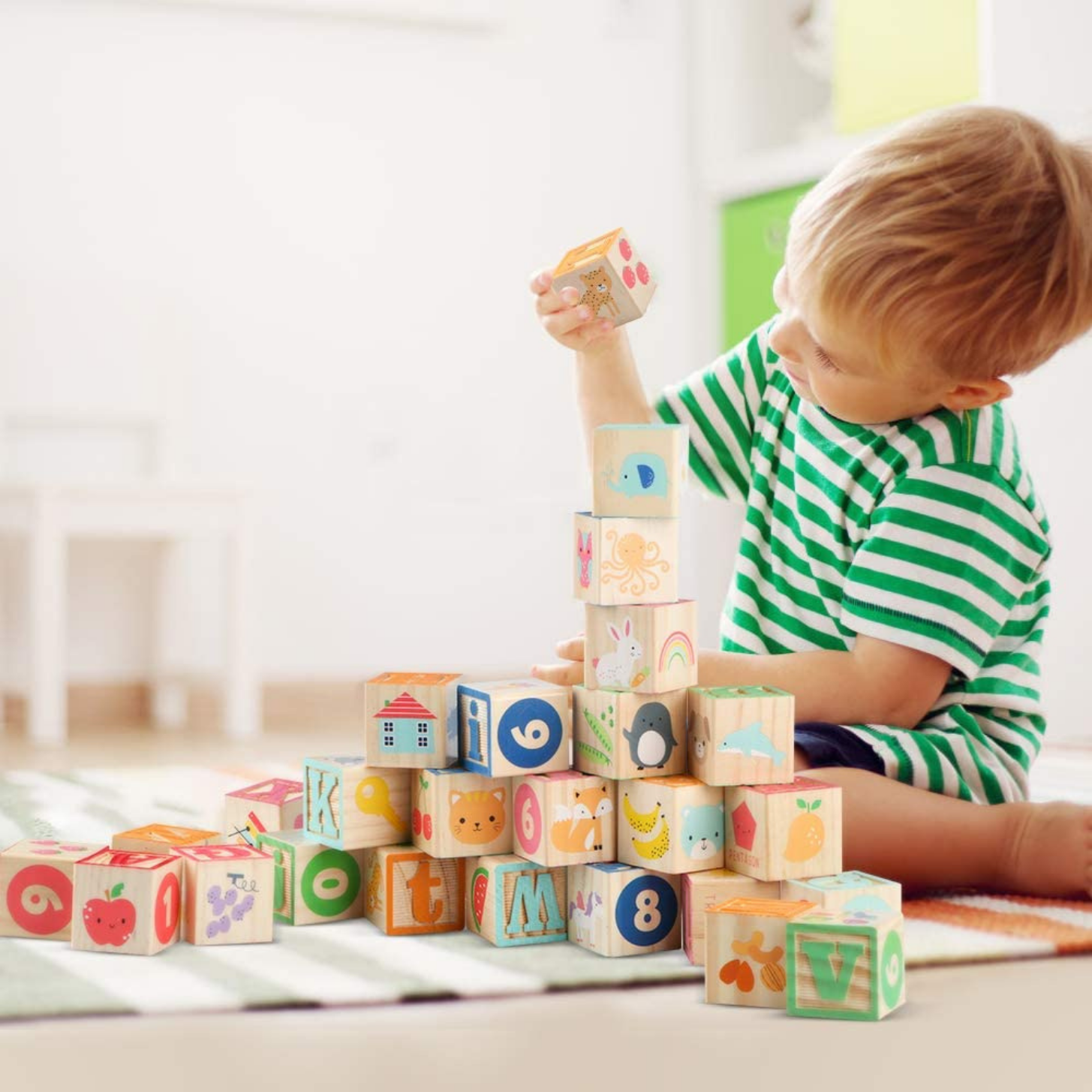 Sensorii's build and play- Boy building with Sensorii's alphabet blocks