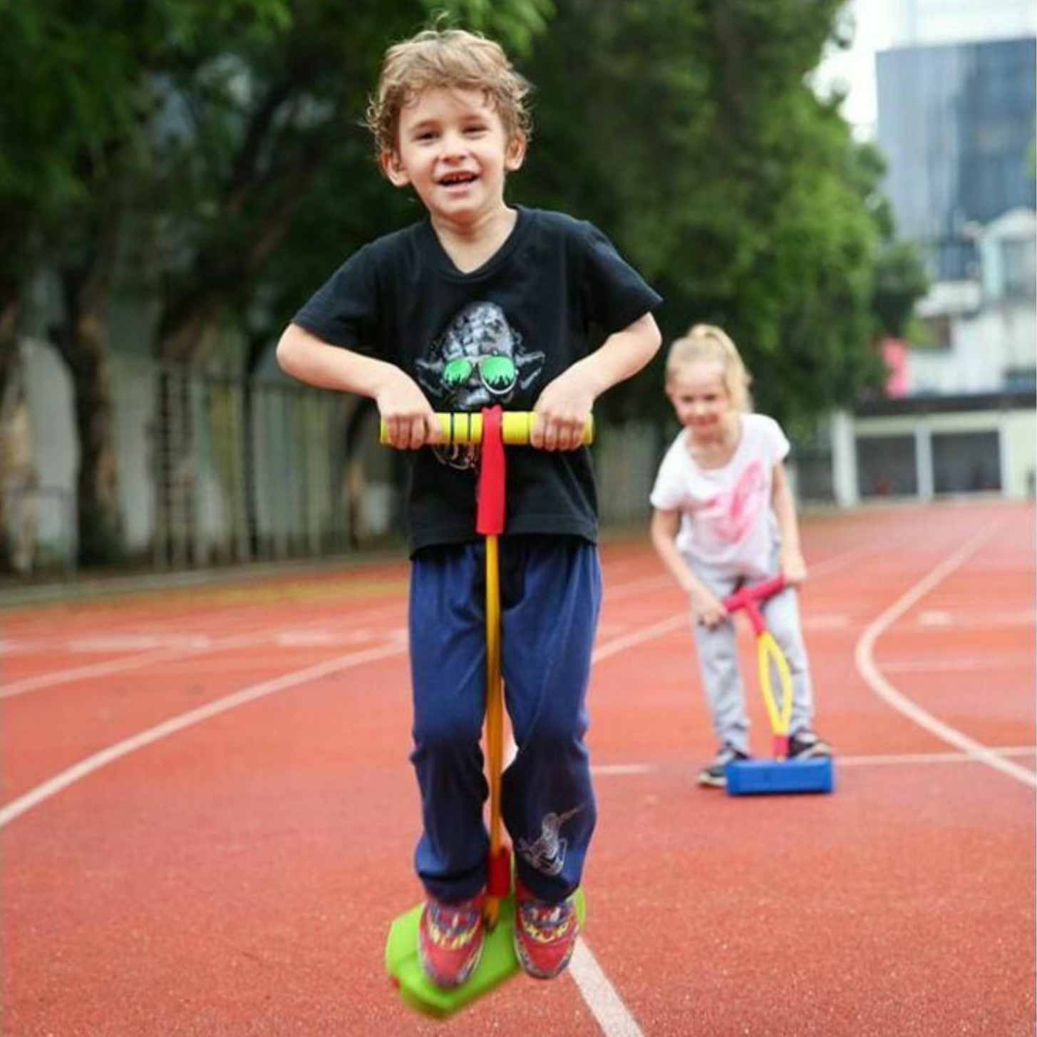 Sensorii's sensory toys- Boy and girl racing on Sensorii's pogo jumper 